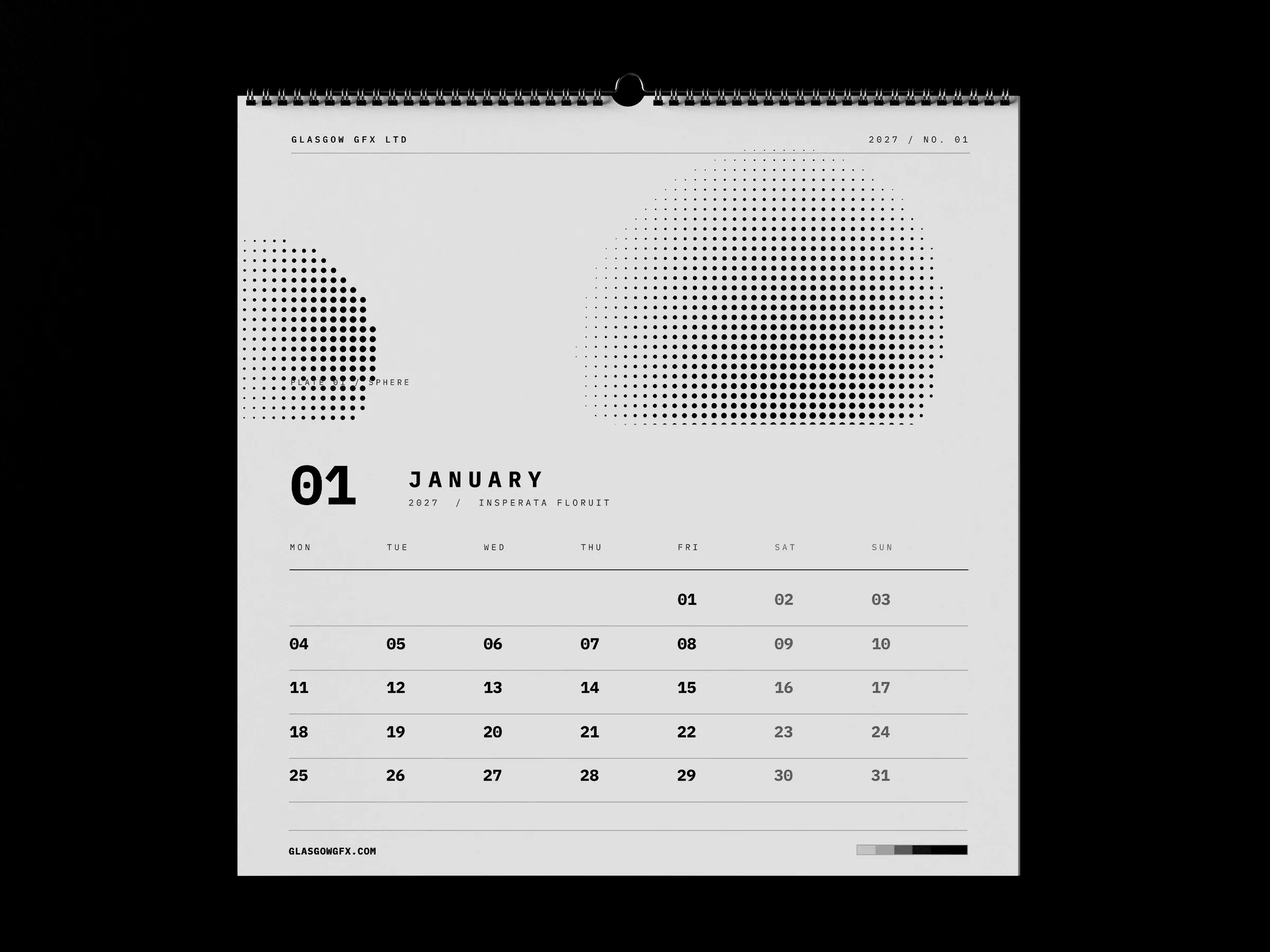 Square wall calendar showing the January page on a white studio surface
