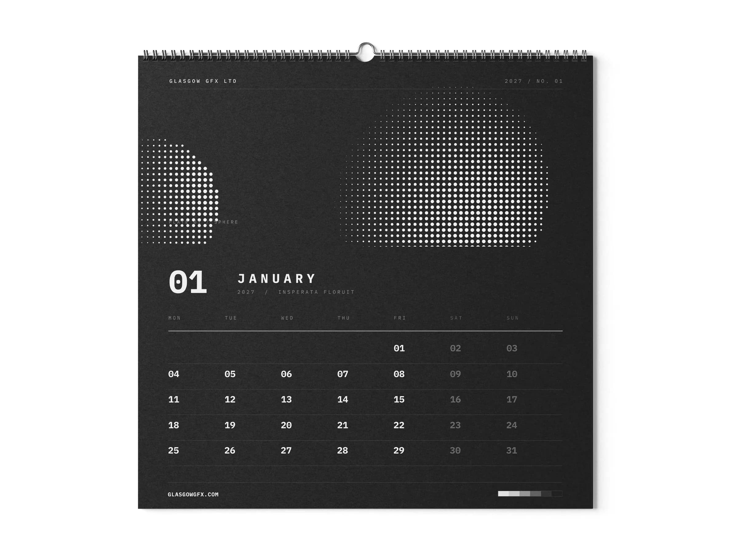 Square wall calendar showing the January page on a white studio surface