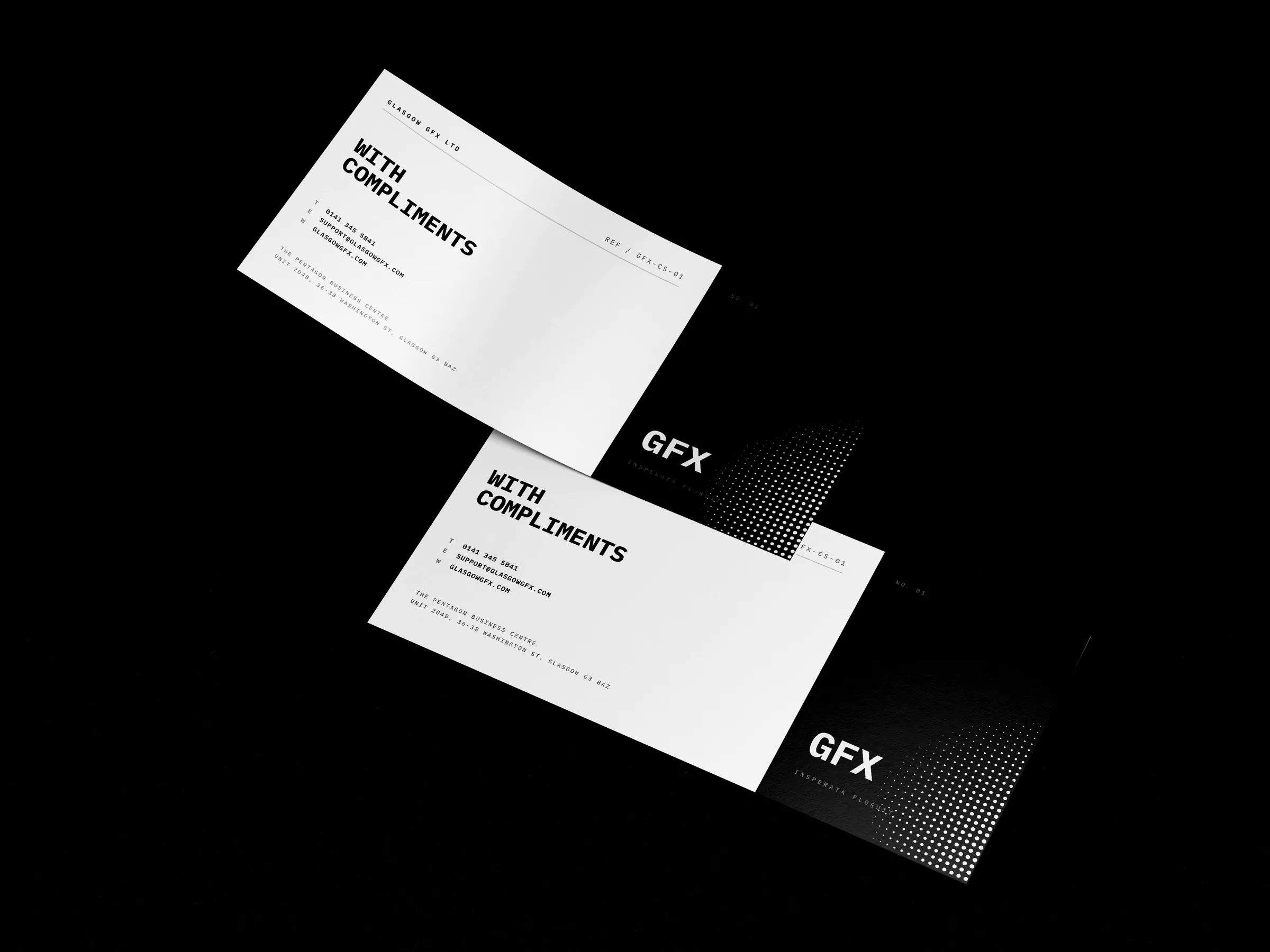 Two DL compliment slips, 210x99mm, overlapping on a white studio surface