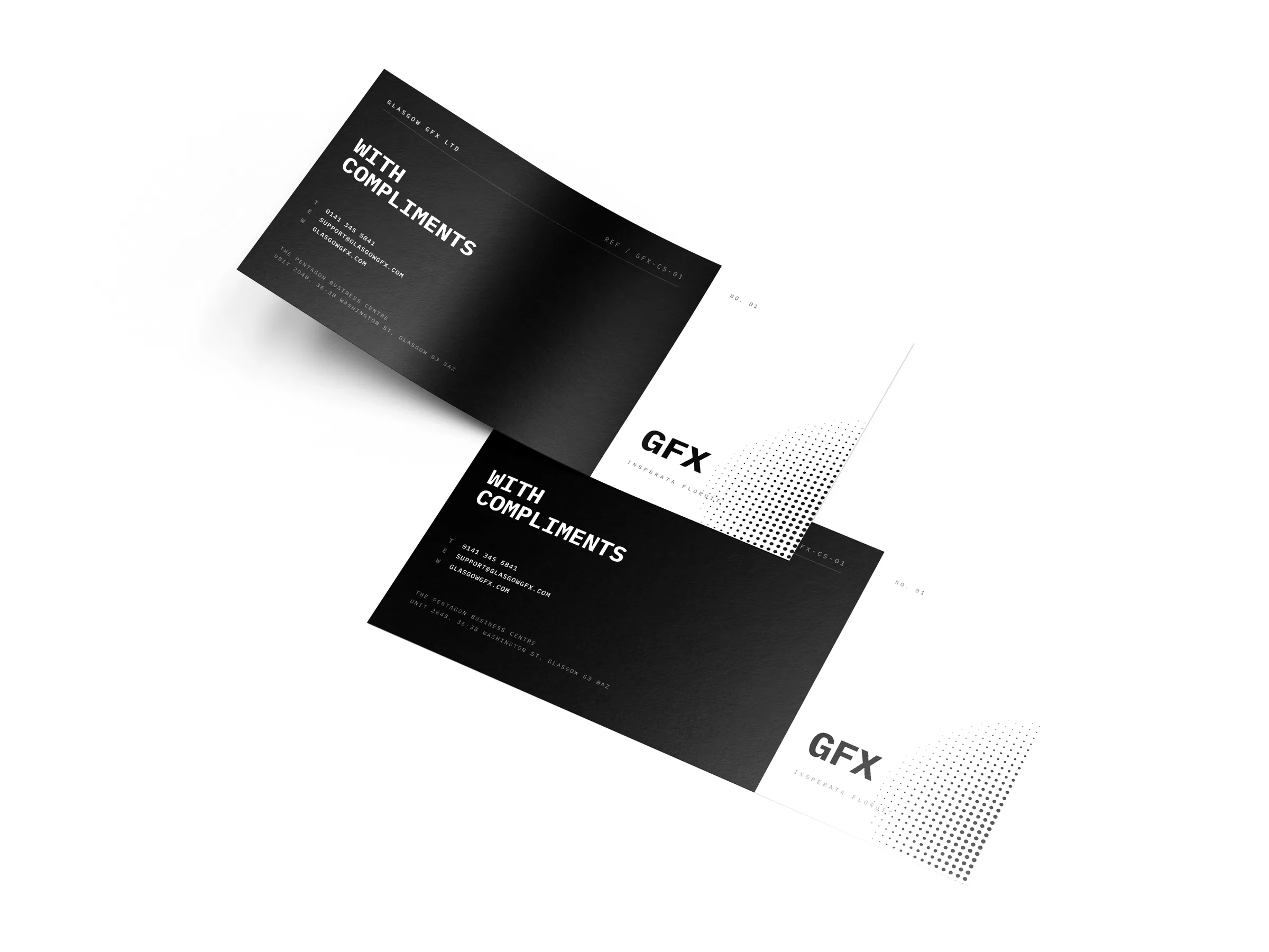 Two DL compliment slips, 210x99mm, overlapping on a white studio surface
