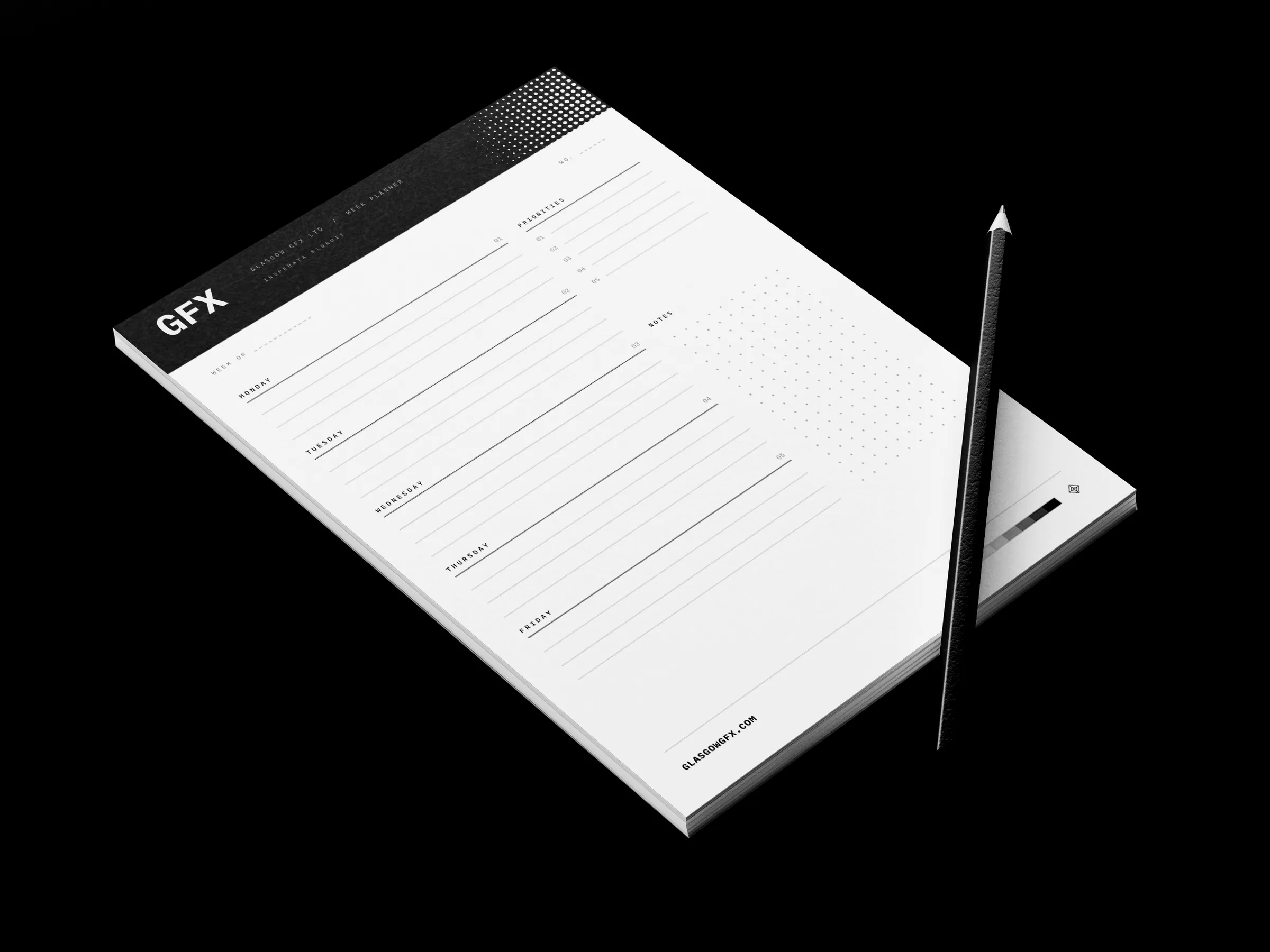 A4 week-planner desk pad with a pencil on a white studio surface