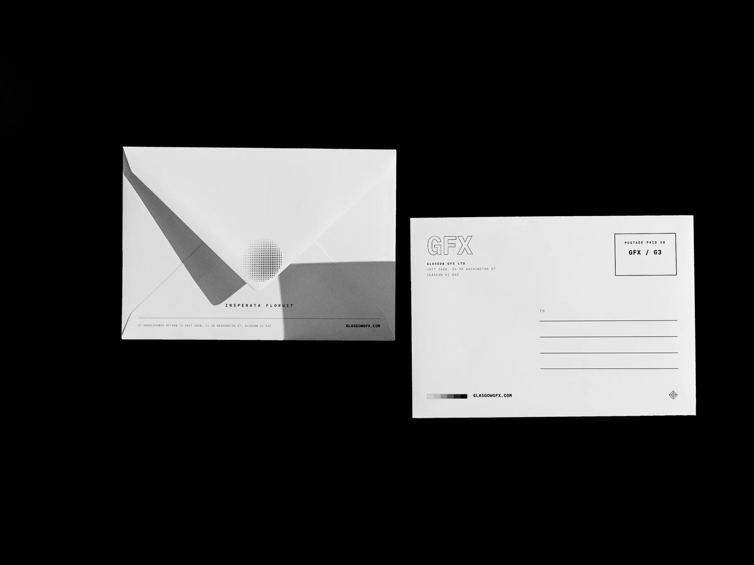 Printed C6 envelopes, flap side and address side, standing on a white studio surface