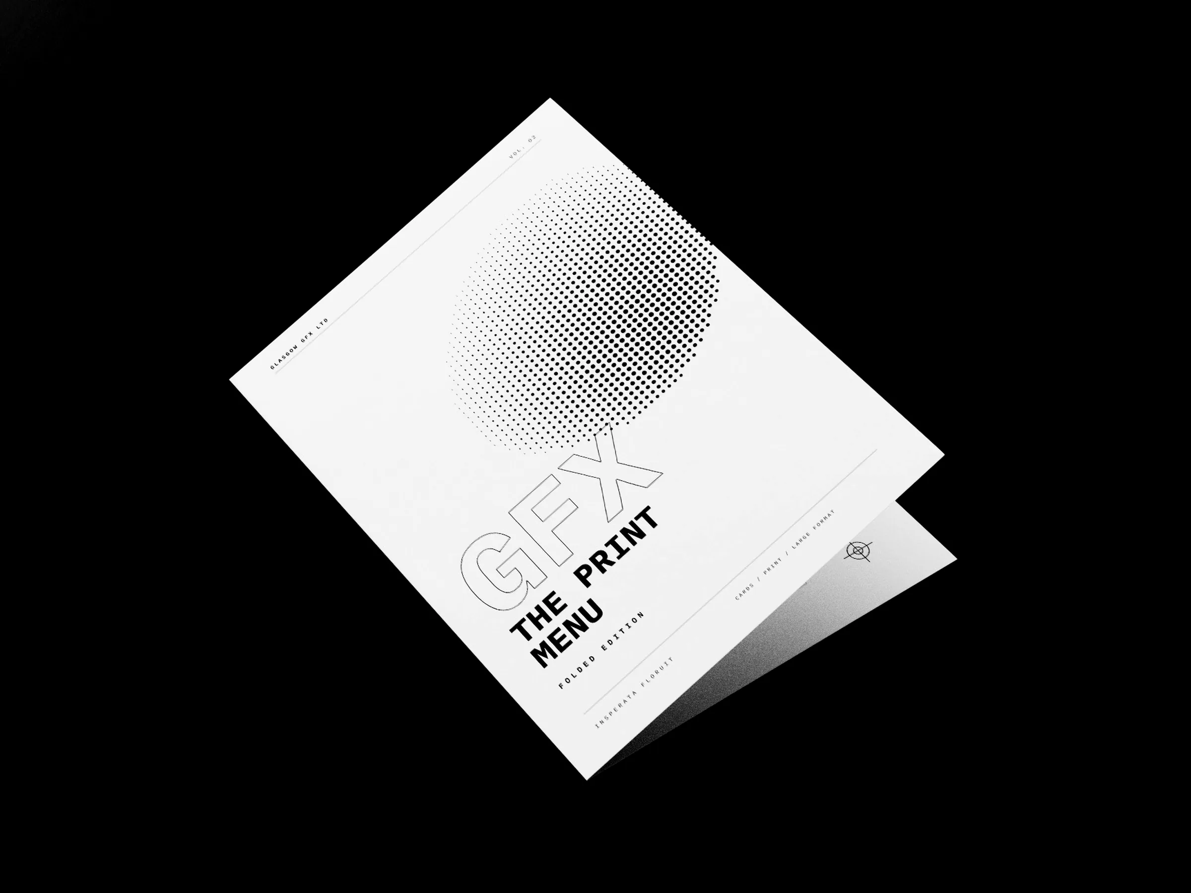 Folded A4 print menu standing part-open, cover facing, on a white studio surface
