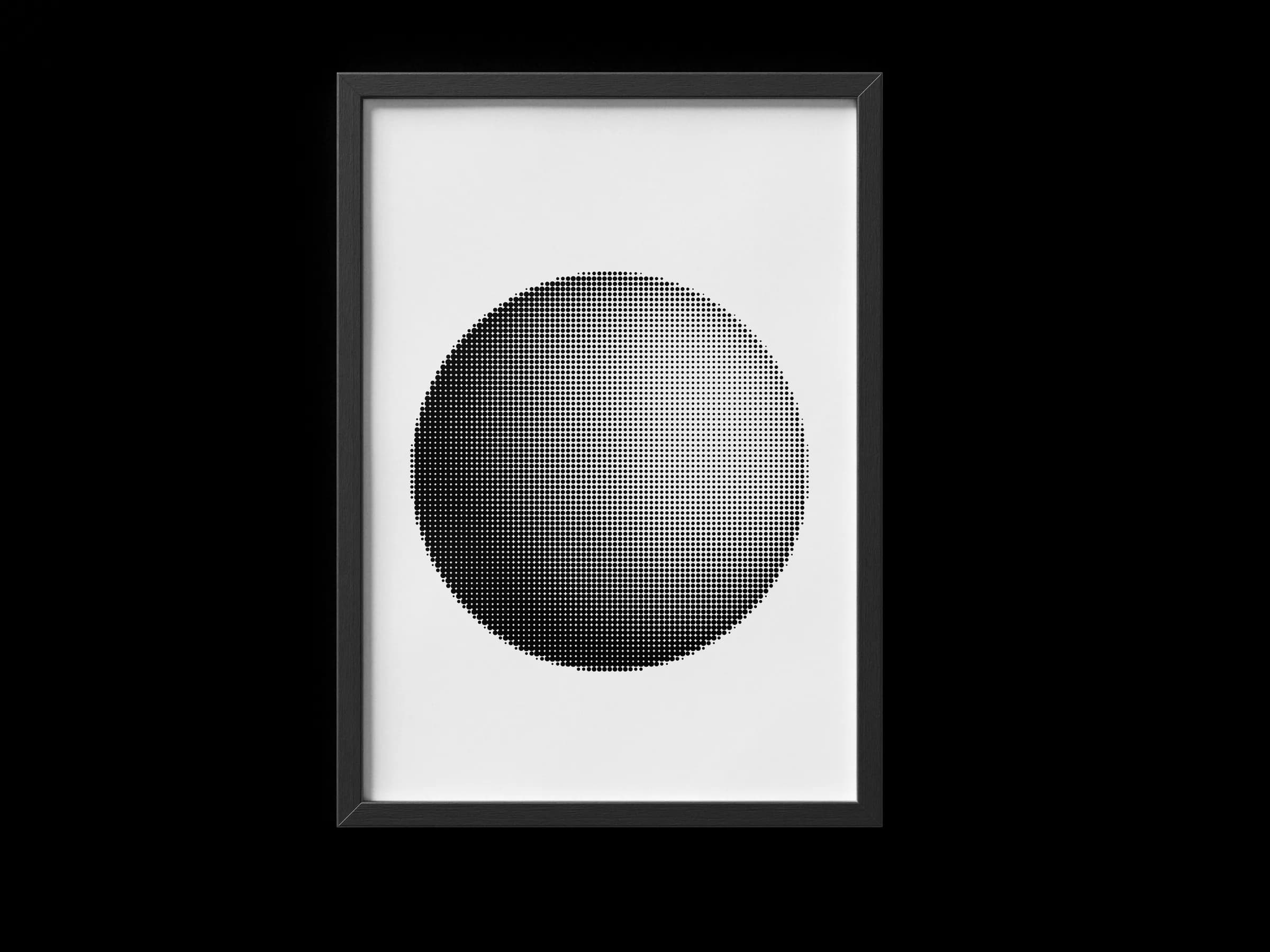 Framed print of a halftone sphere artwork against a white studio background