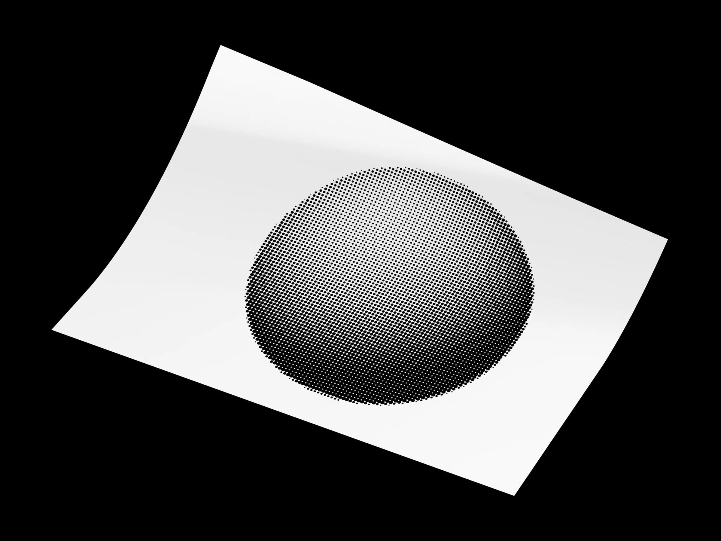 Giclée print of a halftone sphere artwork on a white studio surface