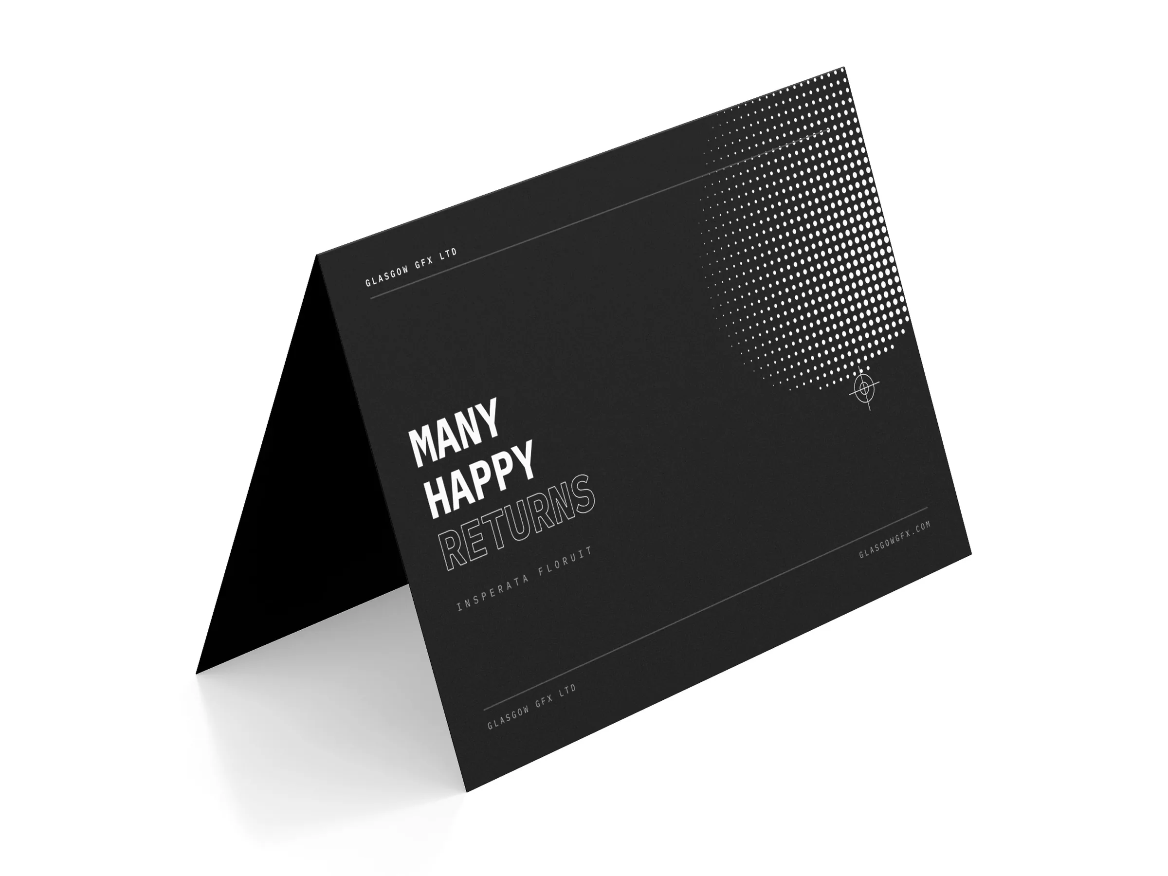 Folded A6 greeting card, 'Many happy returns', standing on a white studio surface
