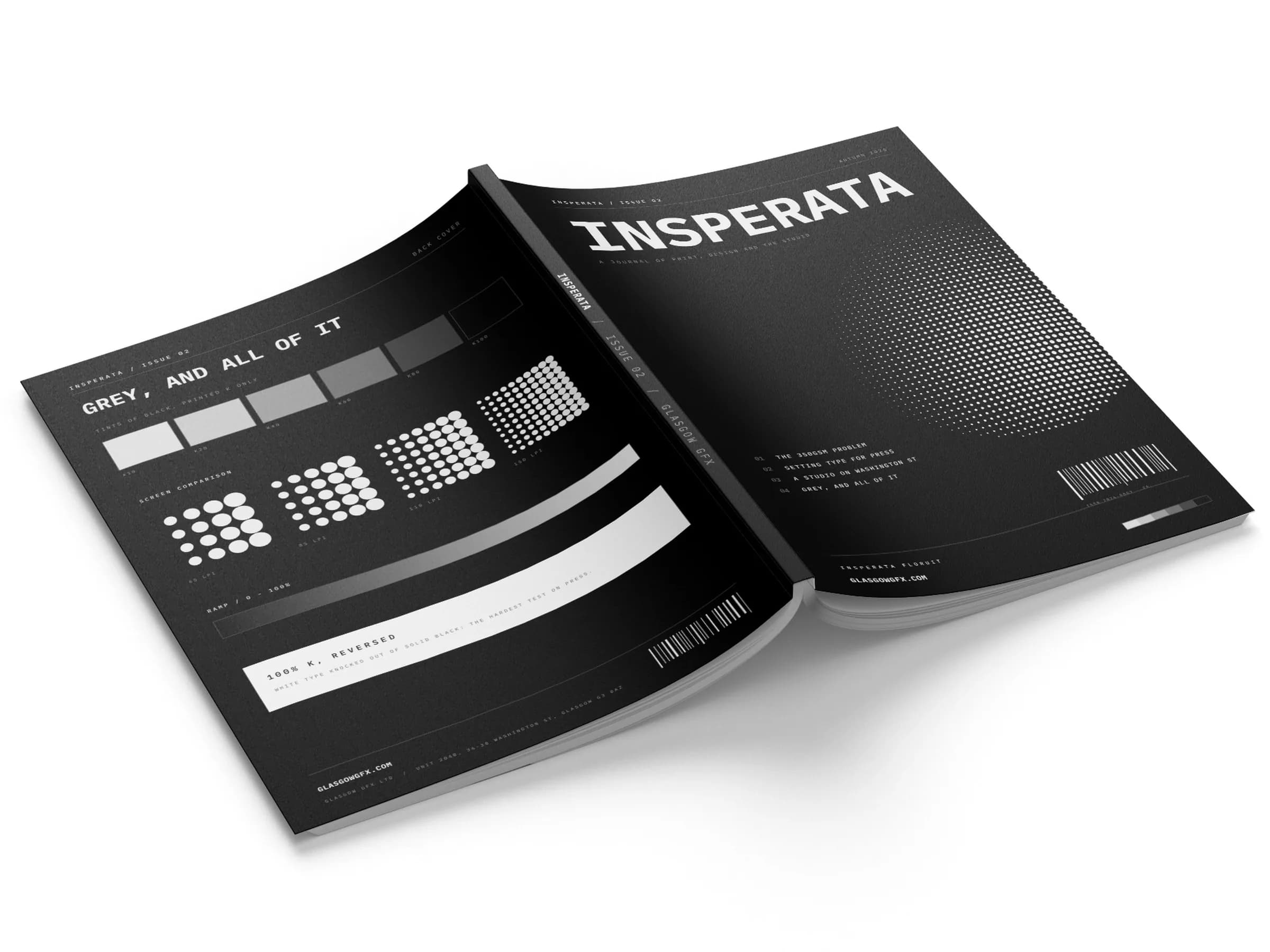 Perfect-bound A4 journal lying open on a white studio surface, front and back covers visible