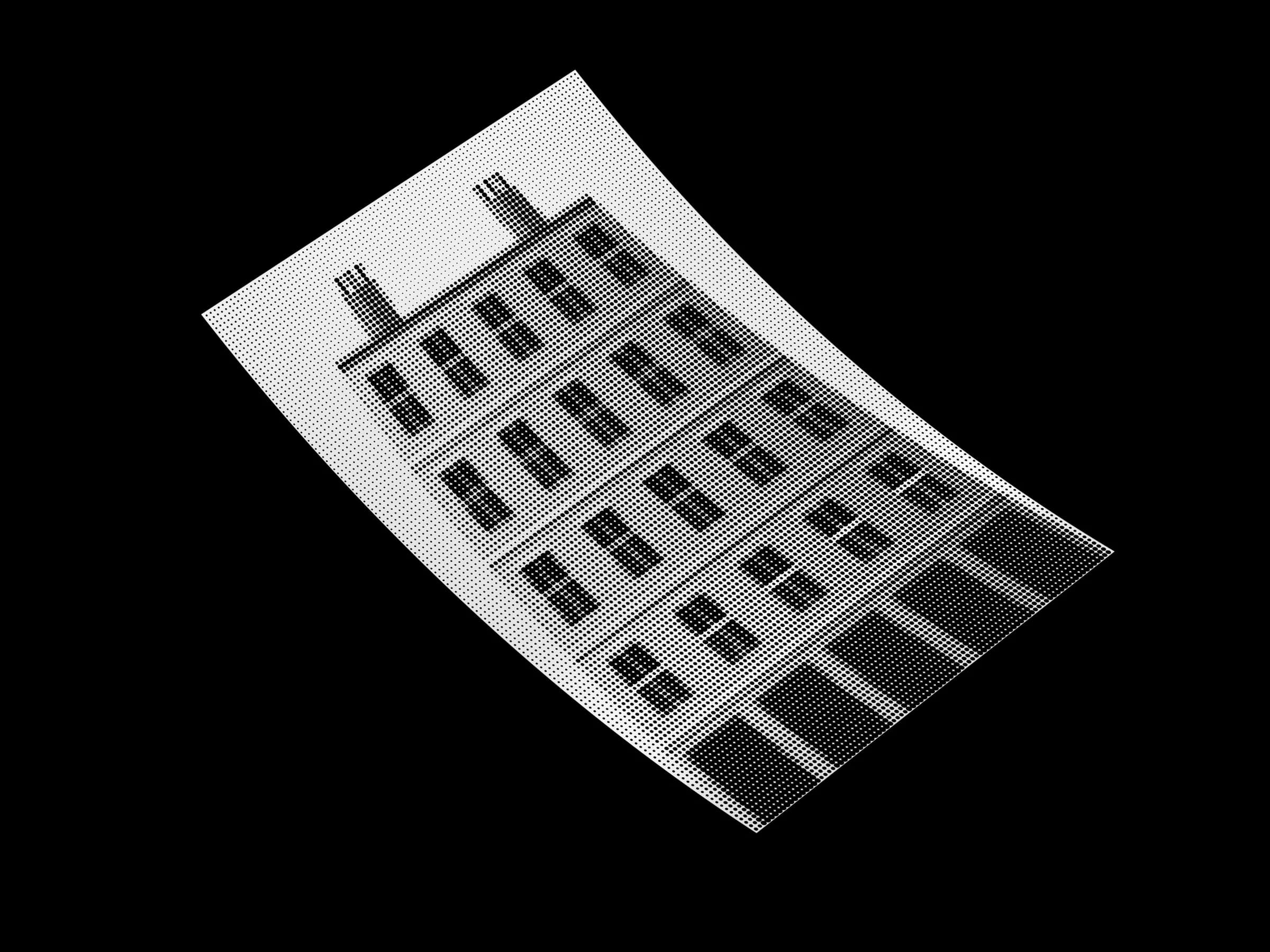 Monochrome halftone photographic print of a Glasgow tenement on a white studio surface
