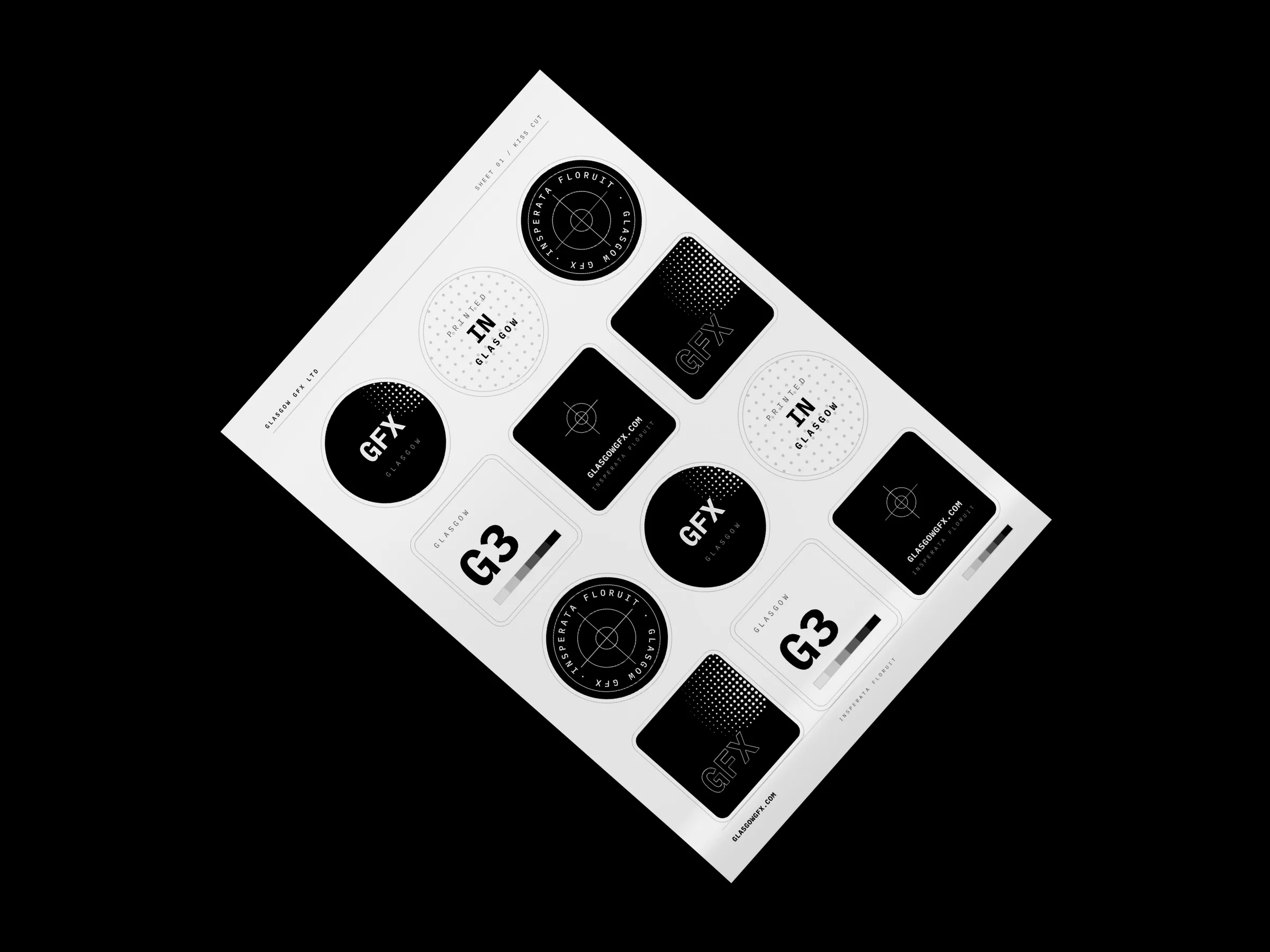 A4 kiss-cut sticker sheet with round and square GFX stickers on a white studio surface