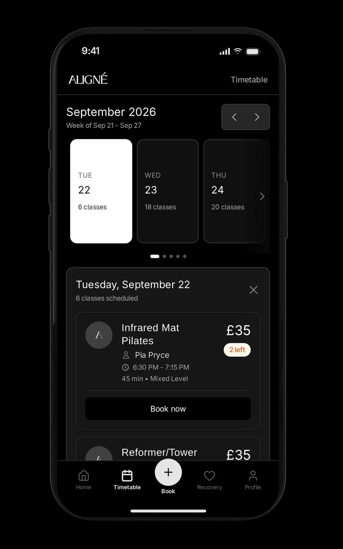 Aligné Studio's booking app on an iPhone