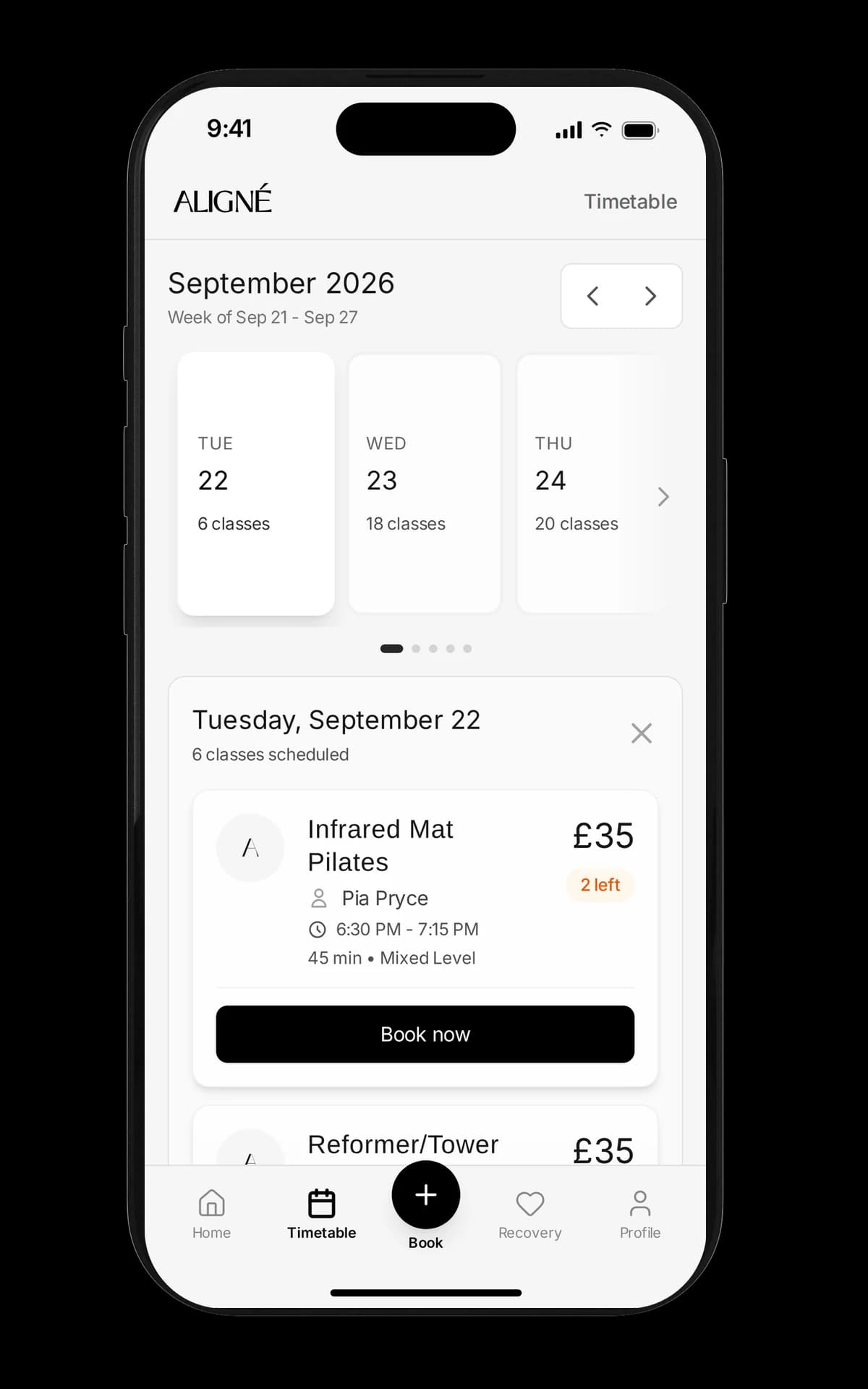 Aligné Studio's booking app on an iPhone