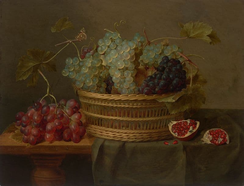 A basket of grapes and a pomegranate on a table as a canvas print