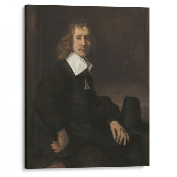 A Young Man Seated at a Table (possibly Govaert Flinck) (c. 1660) - Rembrandt van Rijn - Canvas Print